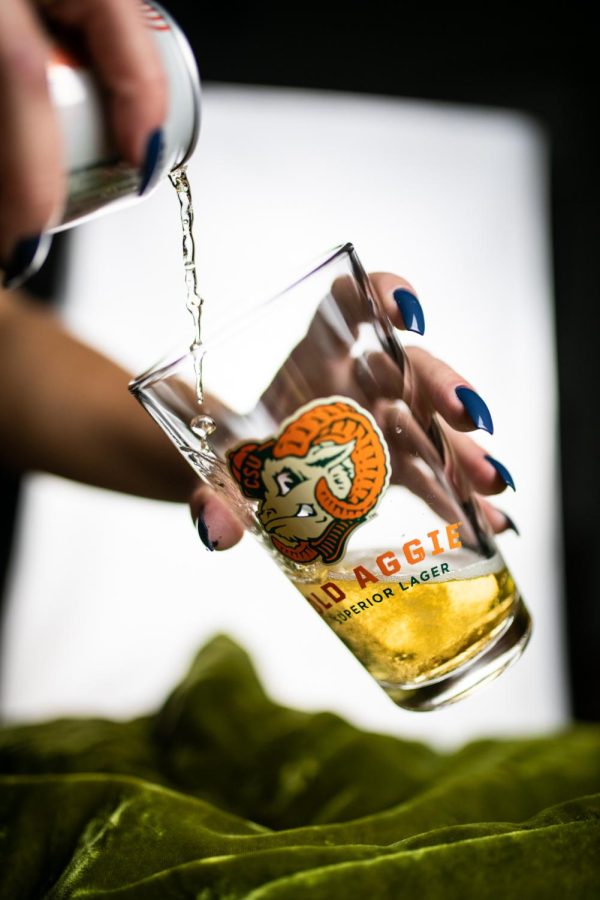 A can of New Belgium Brewing's Old Aggie lager is poured into a pint glass