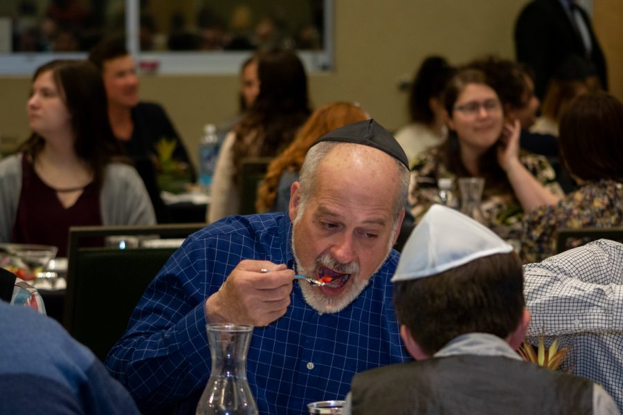 A person eating at the Passover Seder on April 15 at the Lory Student Center.