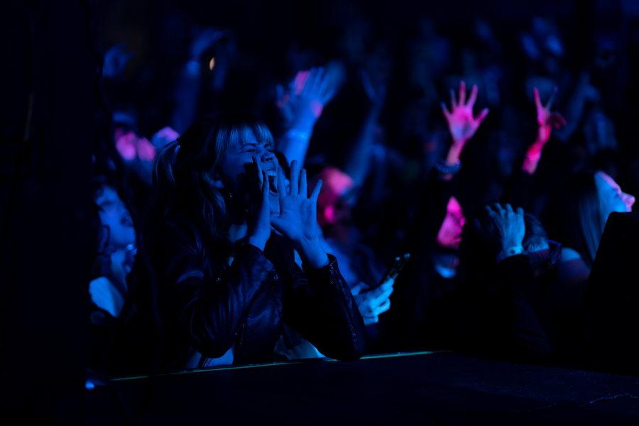 A fan at The Aggie Theater screams for The Velveteers while they play an original song April 16.