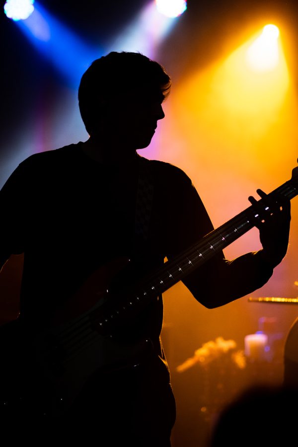 Miles Stevenson plays bass guitar for the band Plasma Canvas at The Aggie Theater April 16.