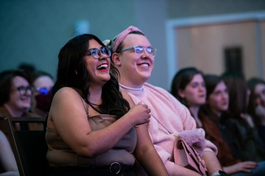 Audience members cheer during a drag artist’s performance
