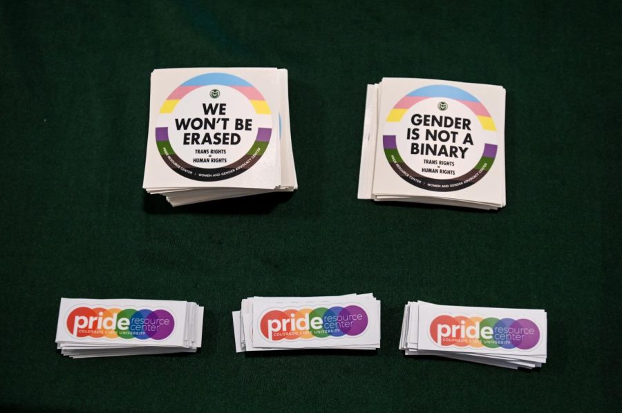 Stickers from the Pride Resource Center sit on a table outside of the Lory Student Center’s Grand Ballroom ahead of the annual drag show