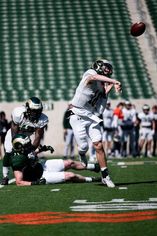 Colorado State University quarterback Brayden Fowler-Nicolosi throws a pass during practice in Canvas Stadium