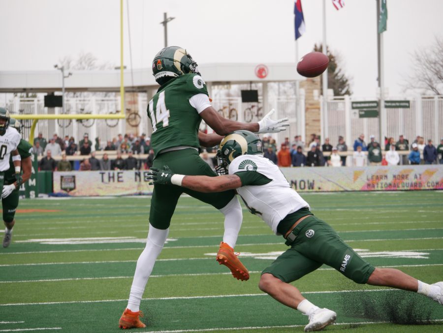 Colorado State wide receiver Tory Horton (14) attempts to catch a pass as defensive back Brandon Guzman (14) breaks up the pass April 23.
