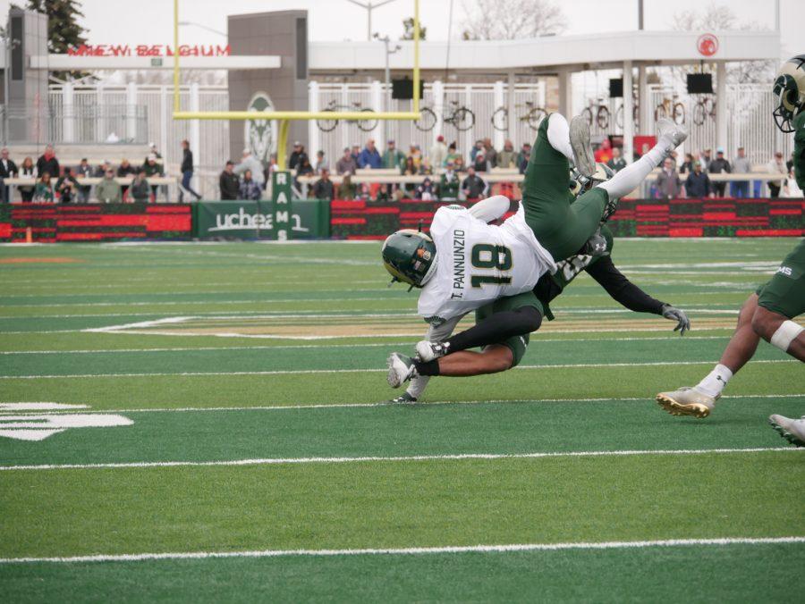 Colorado State wide receiver Thomas Pannunzio (18) catches a pass as he is tackled April 23.