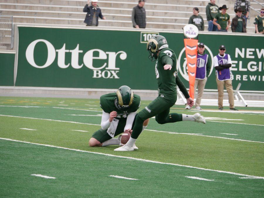 Colorado State kicker Jonathan Terry scores an extra point as Nevada transfer Punter Paddy Turner holds April 23.