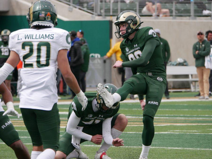 Colorado State kicker Jonathan Terry scores an extra point as Nevada transfer Punter Paddy Turner holds April 23.