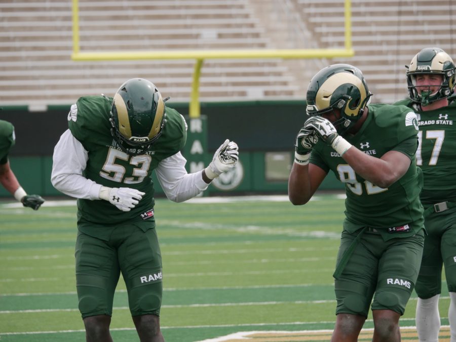 Colorado State defensive linemen Nuer Gatkuoth (53) and Mukendi Wa-Kalonji (92) celebrate a sack by doing the griddy dance April 23.