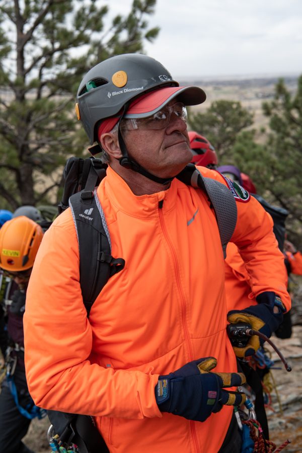 Ed Hildenbrand, coordinator of this years Basic Search and Rescue Training course for Larimer County Search and Rescue puts a radio back on his belt April 25.