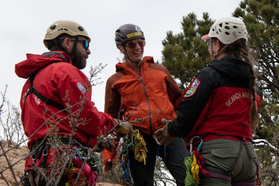Rebecca Clark laughs with Jon Rees and Joyce Dickens at a field training for the Larimer County Search and Rescue Basic Search and Rescue Training course April 23.