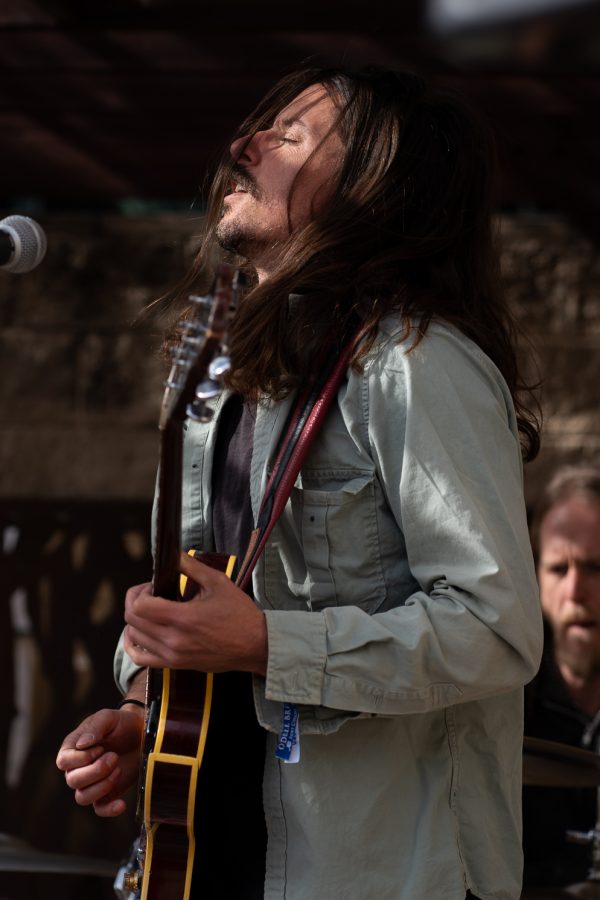 Julian Peterson, lead guitarist for the band Black Moon Howl, plays an original song in the gazebo of The Gilded Goat during Fort Collins Music Experience April 23. FoCoMX was a music festival hosted by Fort Collins Musicians Association showcasing 300 bands at 30 different venues over two days.