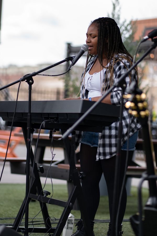 Julia Kirkwood sings an original song at The Exchange of Old Town during Fort Collins Music Experience April 23. FoCoMX was a music festival hosted by Fort Collins Musicians Association showcasing 300 bands at 30 different venues over two days. Julia Kirkwood is 16-Years-Old.
