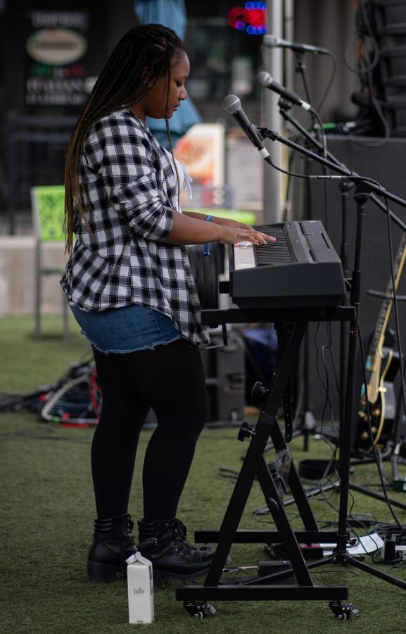 Julia Kirkwood, winner of Sonic Spotlight 2021, sings an original song at The Exchange of Old Town during Fort Collins Music Experience April 23. “This is the third FoCoMX I’ve done and it gets better every time,” Kirkwood stated, “The crowds are always so energetic, it feels like home on every stage.”