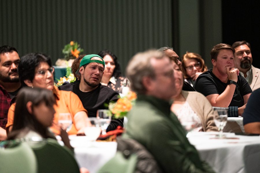 Matt Burt cries in the Lory student center during his mother, Colorado State University's first vice president of diversity Mary Ontiveros' memorial service