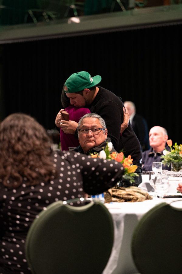 Matt Burt, son of Colorado State Universitys first vice president of diversity Mary Ontiveros hugs a close family friend during Ontiveros memorial service in the Lory Student Center