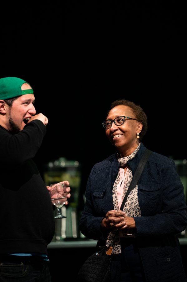 Matt Burtt, son of Colorado State University's first president of diversity Mary Ontiveros talks with CSU's vice president for student affairs Blanche Hughes after Ontiveros' memorial service in the Lory Student Center