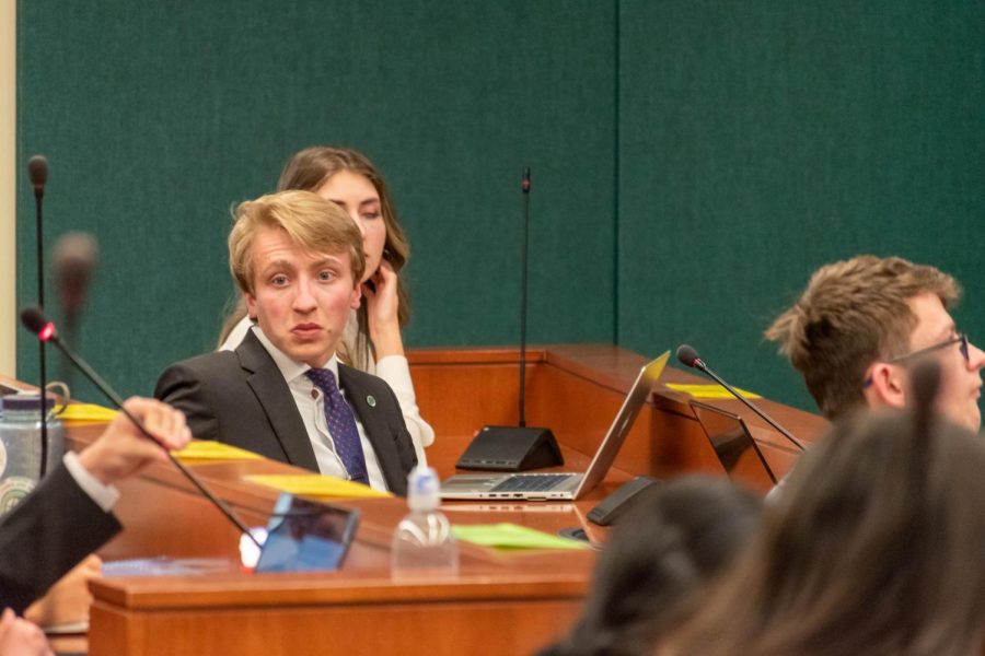 Rob Long, Associated Students of Colorado State University Senator for the College of Business and President-Elect, looks toward a senator explaining their opinion on a proposed bill at the senate meeting April 27.