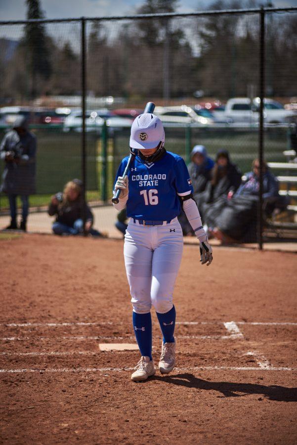 Senior, Kaitlyn Cook, steps out of the batters box to prepare for her next bat April 10, 2022.