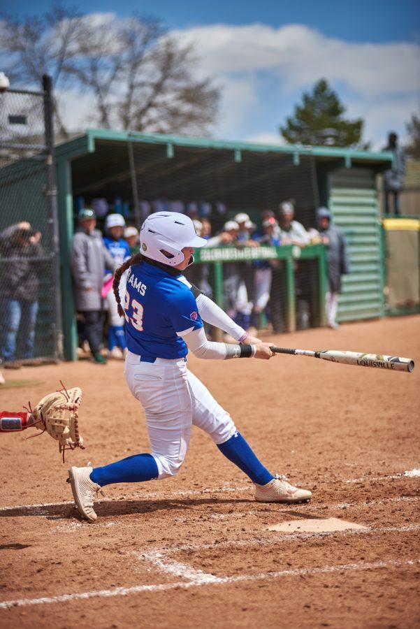 Junior, Peyton Allen, hits a line drive allowing Makenna McVay to score a run April 10, 2022.