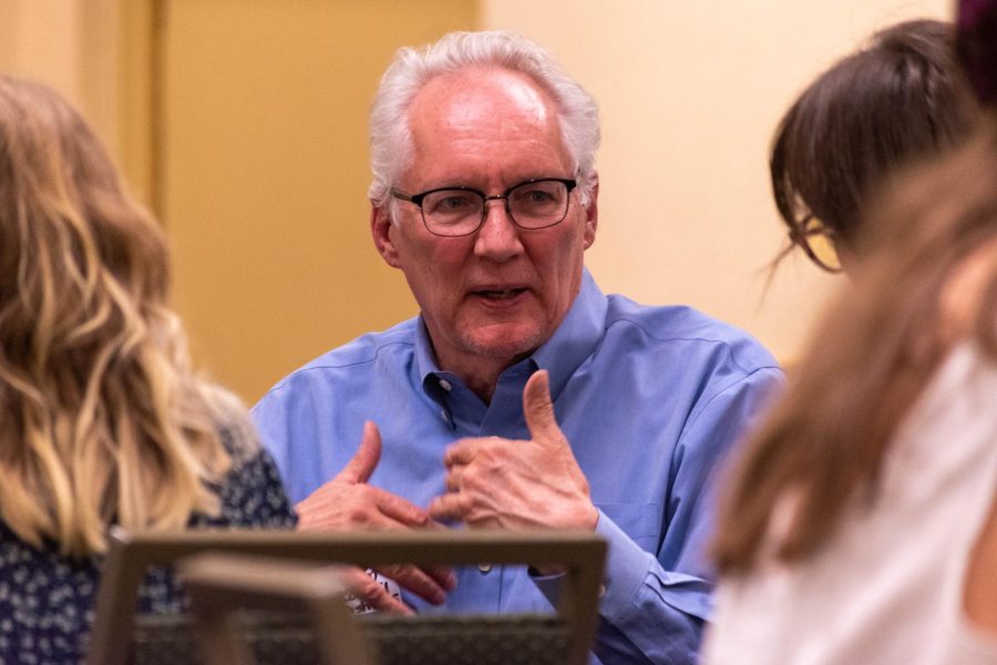 Fort Collins City Councilmember Kelly Ohlson explains his stance on U+2 to a student at the Associated Students of Colorado State University Campus Community Roundtable April 21.