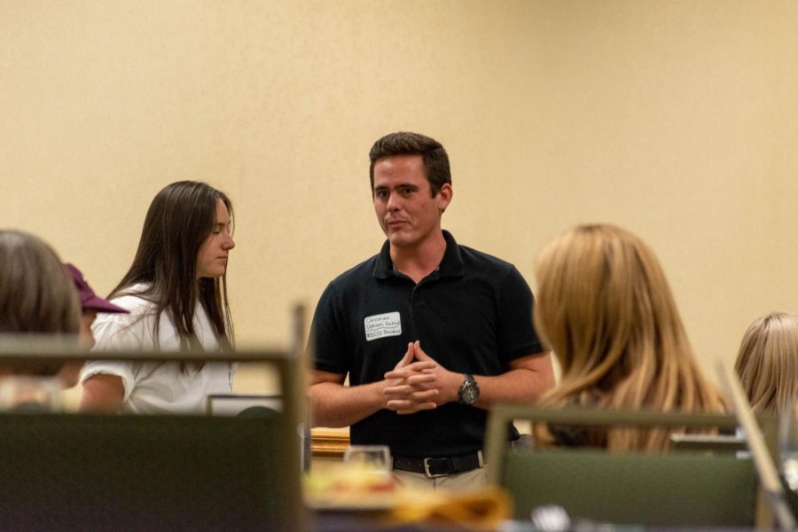 Associated Students of Colorado State University President Christian Dykson welcomes attendees to the ASCSU Campus Community Roundtable event April 21.