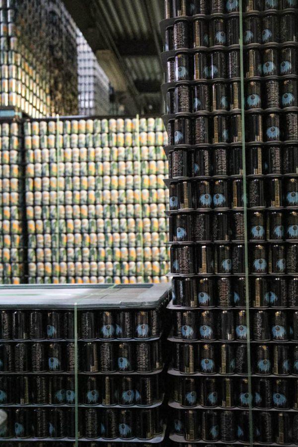 Towers of beer cans sit on palates in the packaging section of Odell Brewing Company April 6.