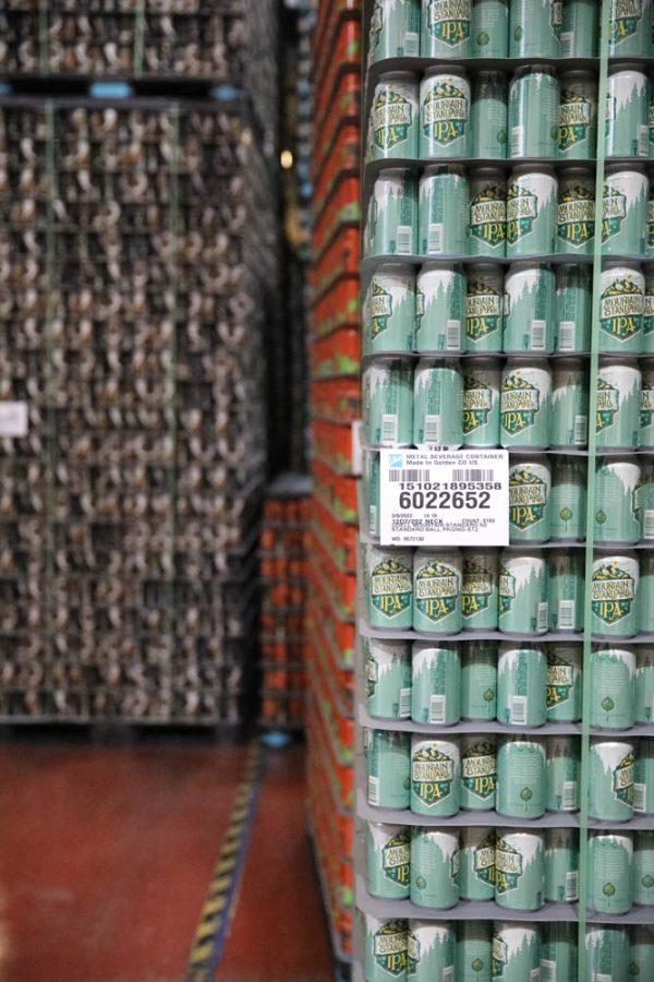 Palettes of beer cans sit in the packaging section of the Odell Brewing Company April 6. Odell does all of their kegging, canning and bottling on site.