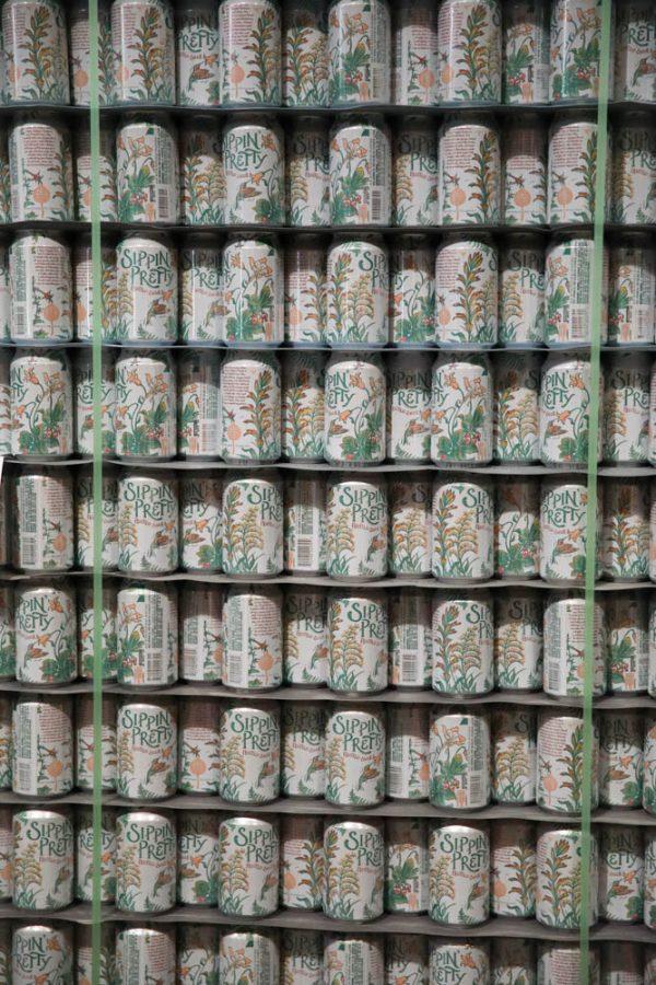A tower consisting of only Sippin Pretty cans sit stacked on top of each other in the packaging section of the Odell Brewing Company April 6.