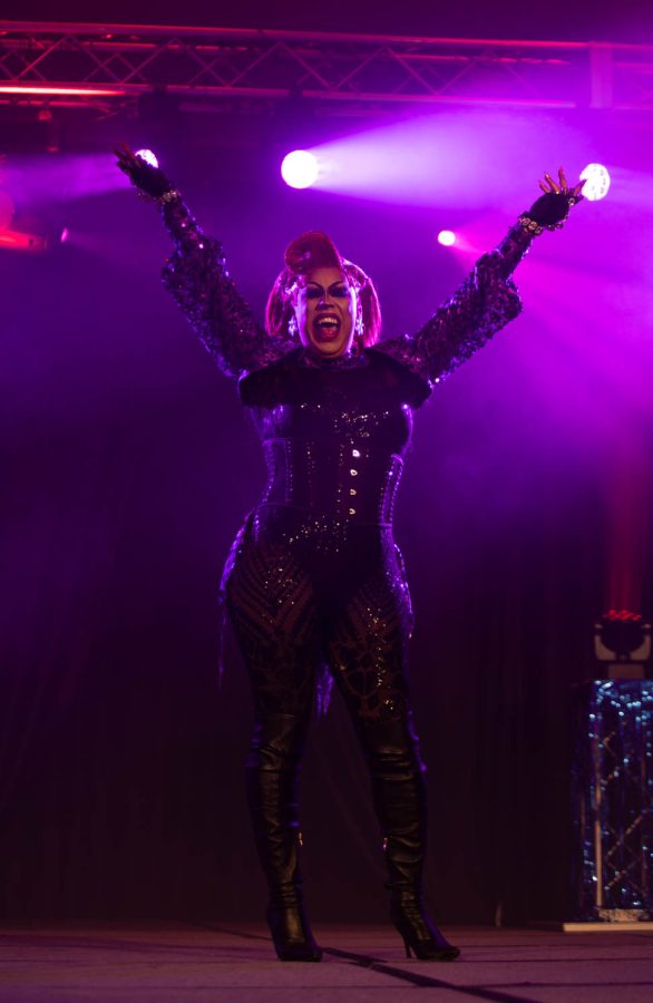LaLa Queen raises her arms on stage during the Colorado State University Drag Show: Resurrection April 16.