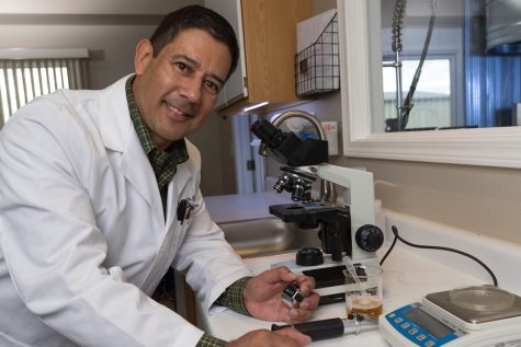 Dr. Keith Villa working in a lab.
