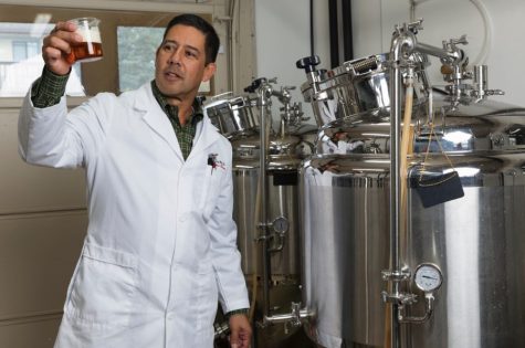 Dr. Keith Villa looks at some beer.