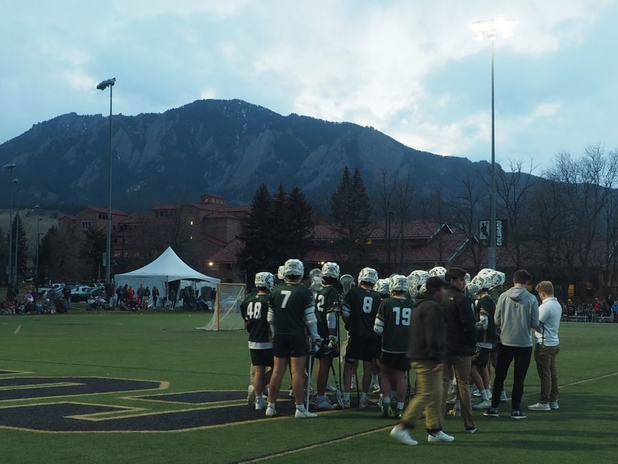 The Colorado State mens lacrosse team huddle up during a timeout April 16.