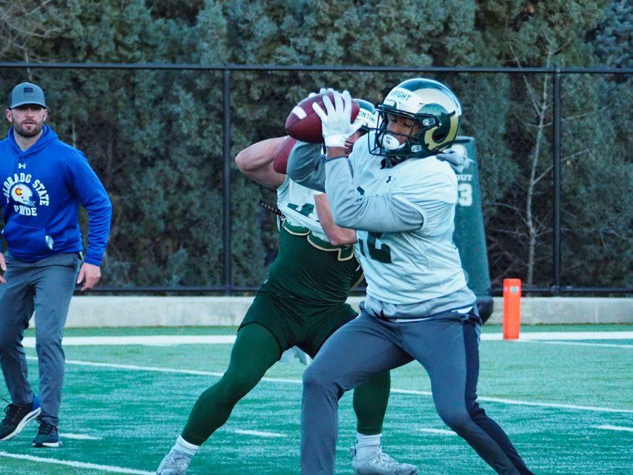 Senior wide receiver Dante Wright (22) catches a pass during Colorado State football practice March 31, 2022