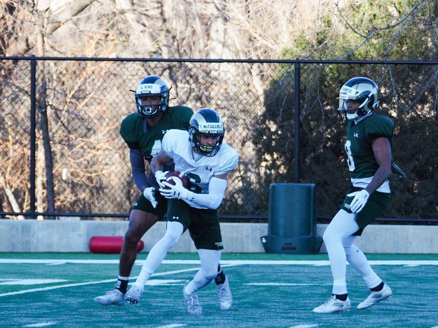 Senior wide receiver Ty Mccullouch (6) runs the ball upfield after catching it off a pass during the Colorado State football practice March 31, 2022.