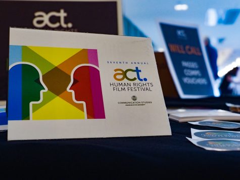 The logo for the ACT film festival on a check-in table March 31, 2022.