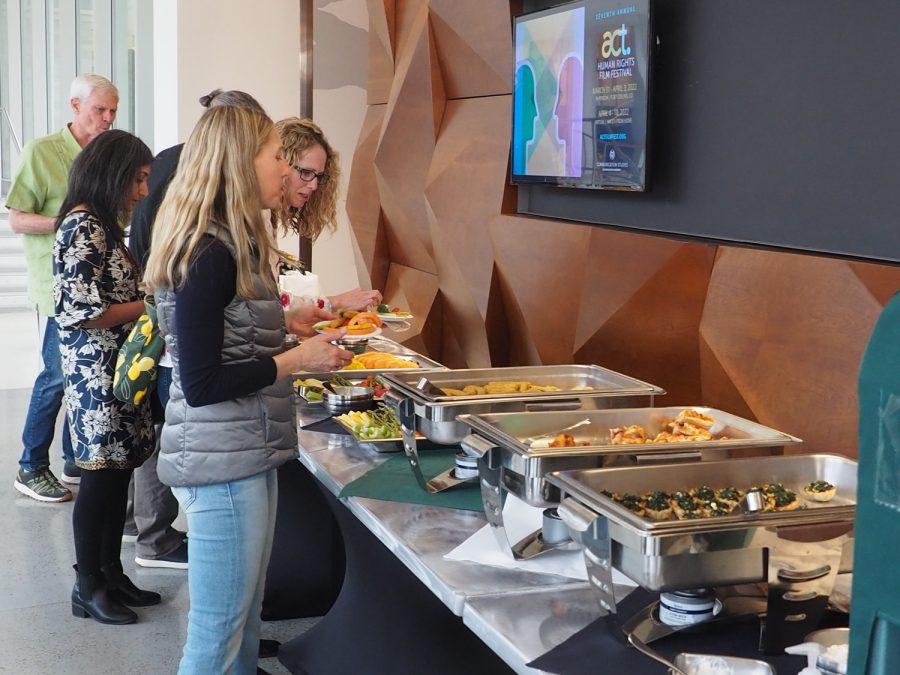 Guests attending the ACT film festival help themselves to catered food provided by the Lory Student Center Catering services March 31, 2022.