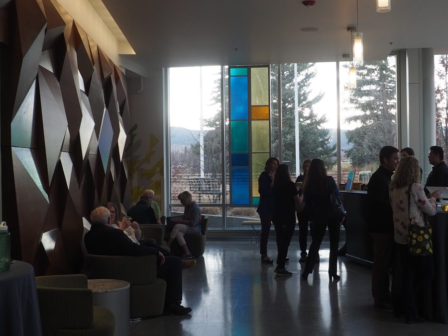 Guests mingle outside the Lory Student Center Theatre prior to the showing of the film "The Caviar Connection: How to Buy Democracy" March 31,