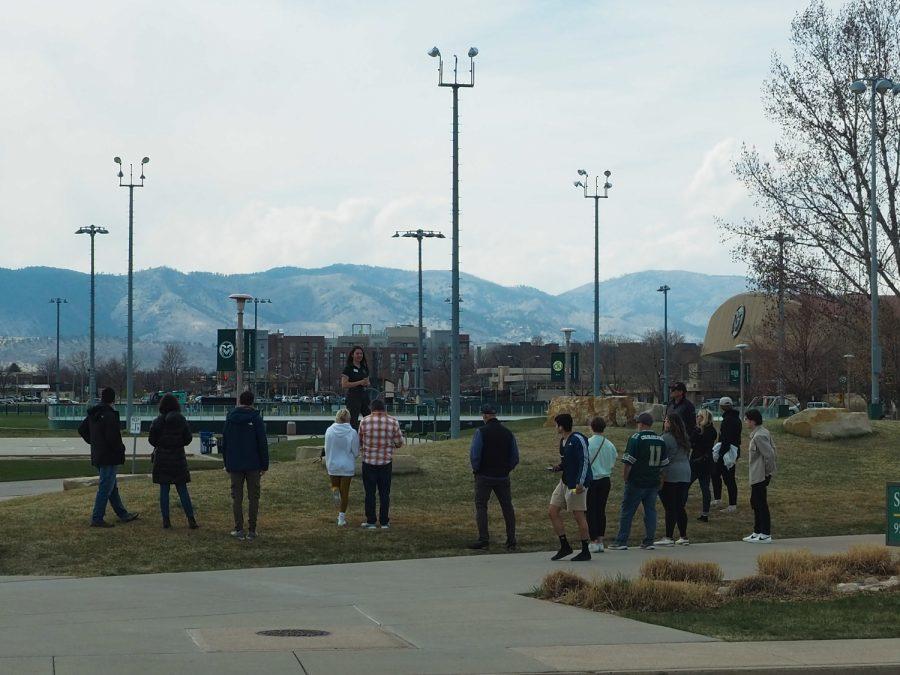 A group of prospective Colorado State University students listen to a tour guide outside the Student Recreation center on a campus tour April 15.