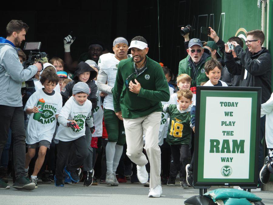Colorado State head football coach Jay Norvell leads the participants of the Spring Youth Camp out of the tunnel April 23.