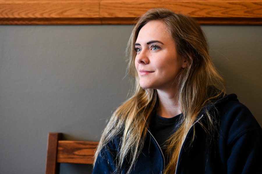 Senior Ren Bergeron sits inside of Guggenheim Hall