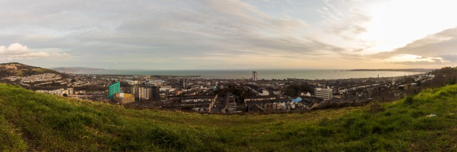 A panorama of Swansea Bay at sunset