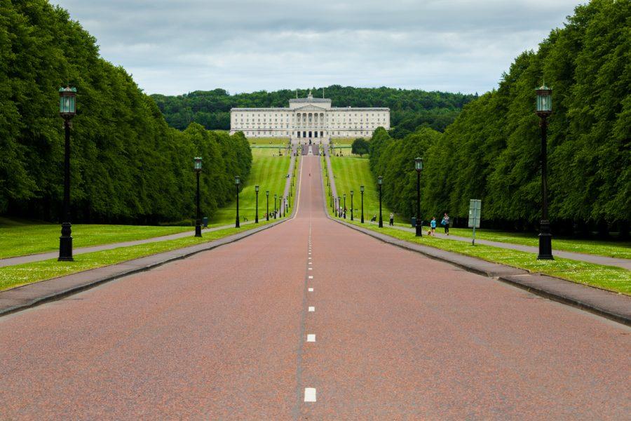 A road leads to a white building