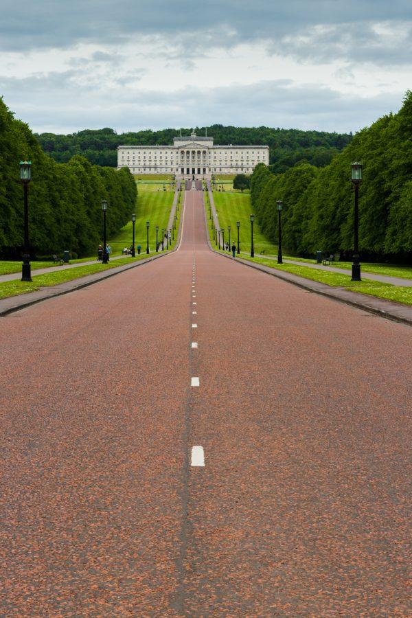A road leads to a white building