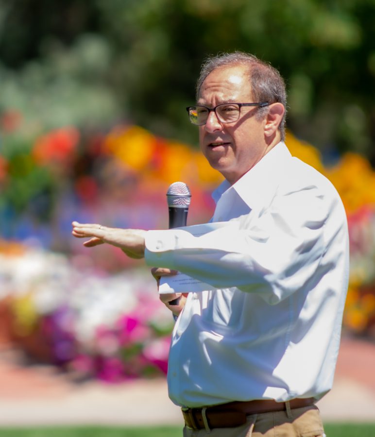 Rick Miranda, Interim President of Colorado State University speaks in front of the audience.