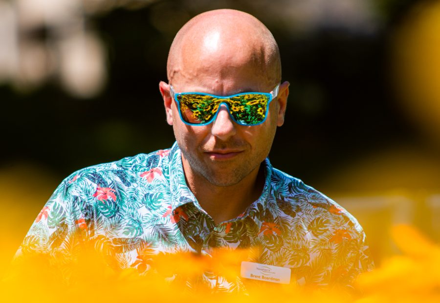 Brent Boardman, Sales representative from Vaughan's Horticulture, evaluates flowers at the Colorado State University Annual Flower Trial Gardens.