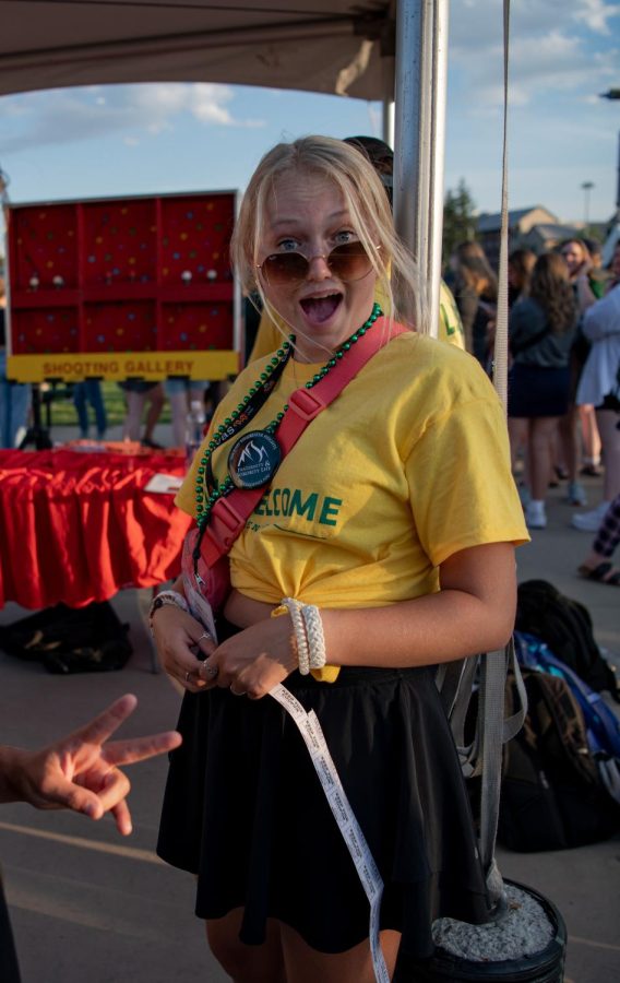 A Ram welcome leader distributes carnival tickets on the Colorado State University intermural fields during a carnival Aug. 18