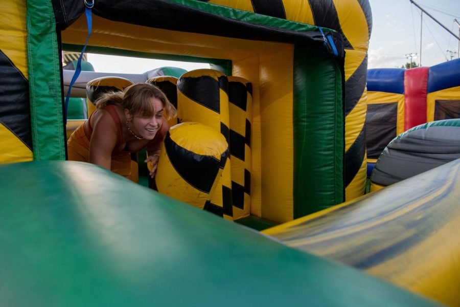 A participant of the Colorado State University Ram Welcome race through inflatable obstacle courses on the intermural fields Aug. 18