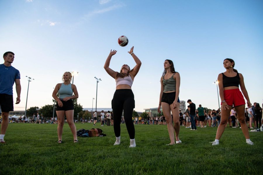 Participants of the Colorado State University Ram Welcome hit a volleyball around a circle on the intermural fields Aug. 18