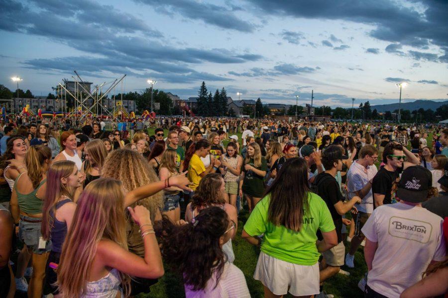 Participants of the Colorado State University Ram Welcome Carnival form a dance circle on the intermural fields Aug. 18