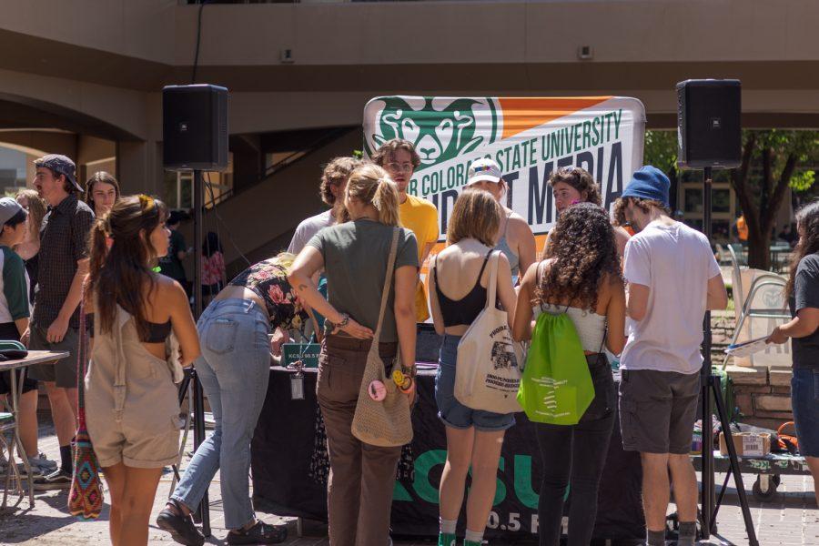 Students gather at the KCSU radio station table